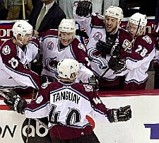 Tanguay around the bench after he scores