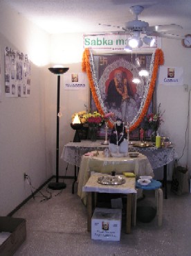 Baba's Murthy with Samadhi mandir photo in backdrop