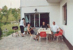 Welcome barbeque. Dad & neighbour are eating, mum has to cook