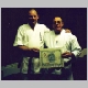 Mr. Lee Norton is presented a certificate of promotion from Sensei Harrill