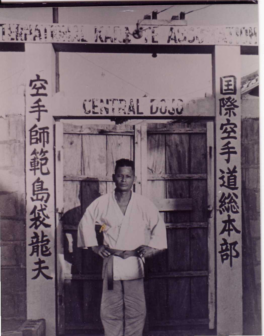 Shimabuku Sensei at the gate to his dojo.