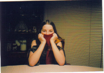 Me on my 14th b-day (March 13) Like my Harry Potter scarf?