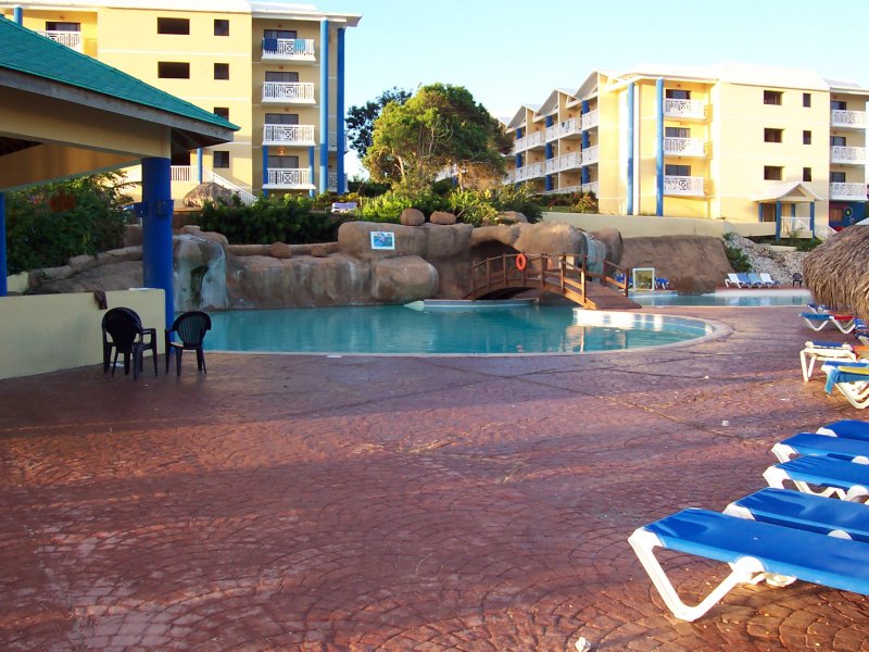 Our bar, and pool where we hung out mostly. Thats our building stright ahead and left. The end of the hallway from where I took the first picture in the series is the third one up.