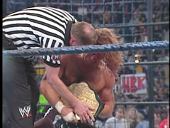 Earl Hebner presents Shawn with the World Title
