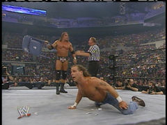 Trips punishes Shawn with a chair