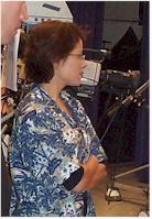 Director Roxann Dawson observing a scene shooting.