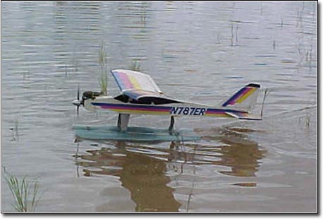 Bernie Collins taxies thru the grass