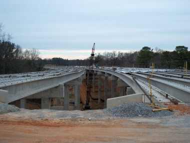 dual-span concrete bridge across the Black Warrior connecting Jack Warner Pkwy with Rice Mine Rd
