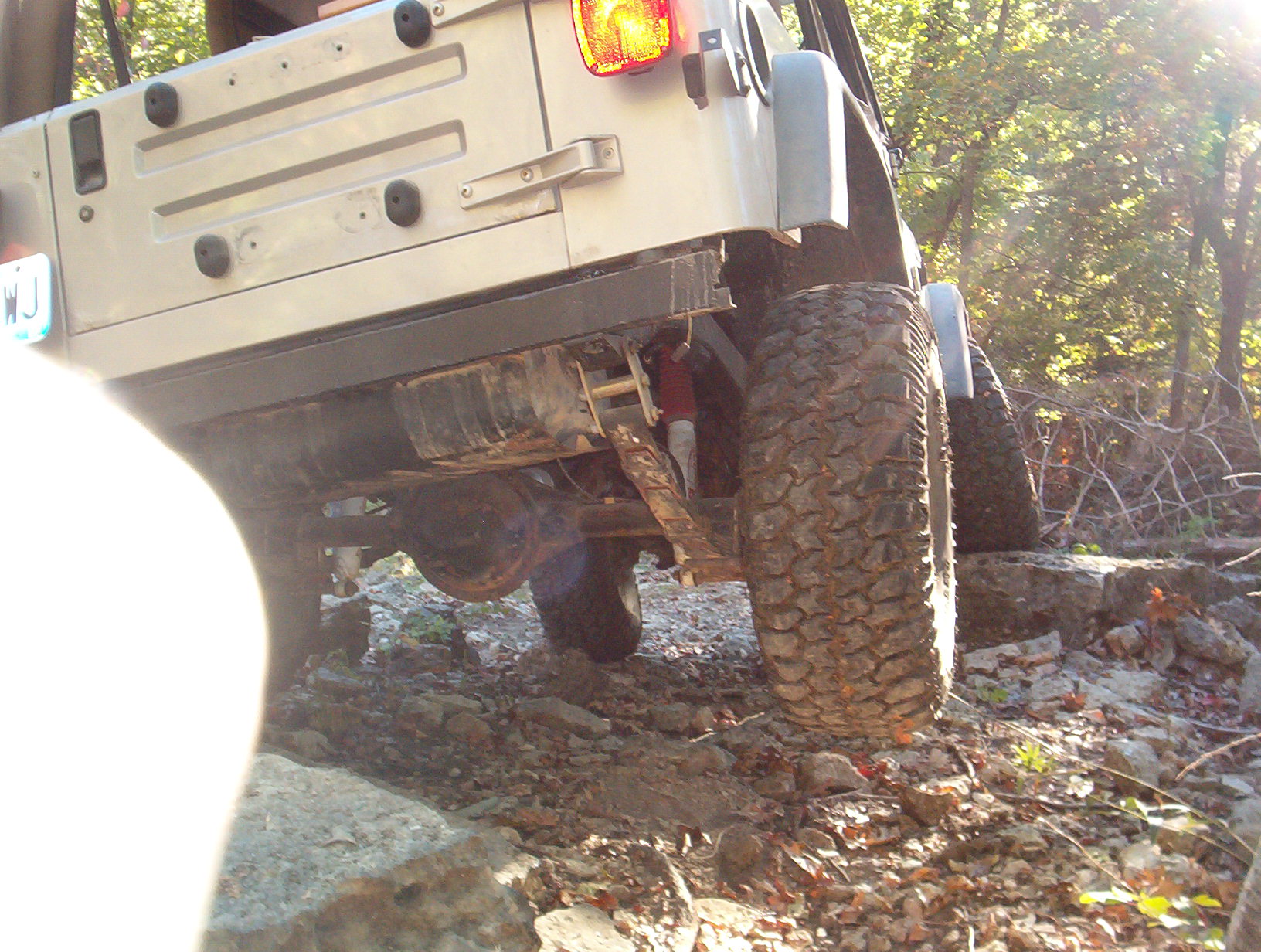 18" or so between the tire and terra firma