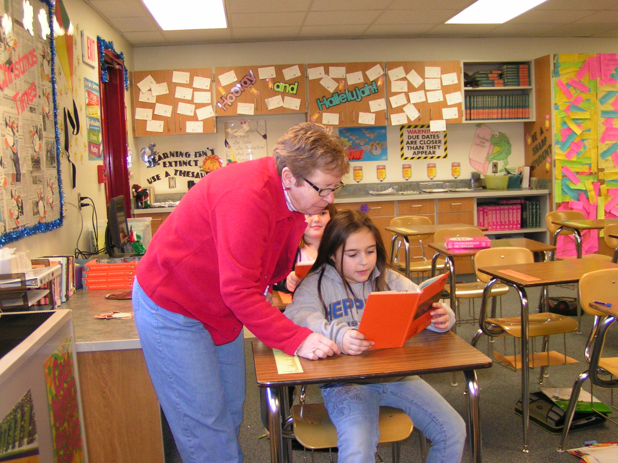 Mrs. Allen assists one of her students