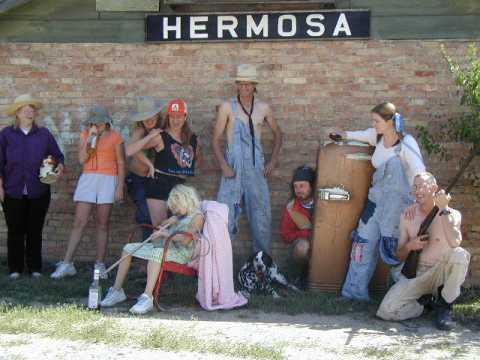 They dress up like hillbillies...and then people take pictures of them, that's just how it works around Hermosa.