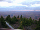 A view from the top of the lookout tower as the sun sinks below the horizon.