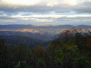 As the sun sets in the west (as it often does), the hills to the east were illuminated with patches of color.