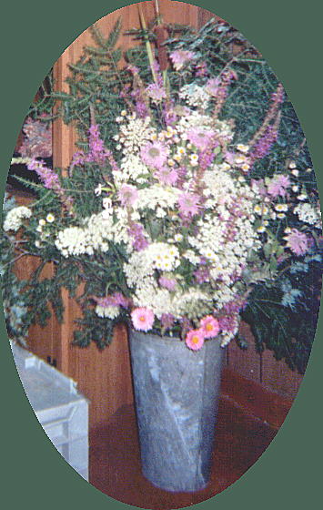 wild flower arrangement w/ evergreen back