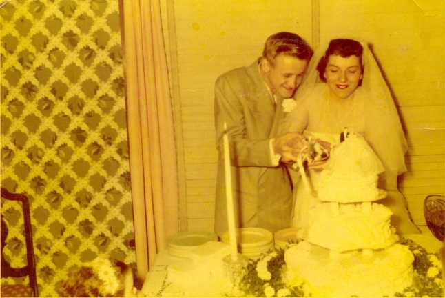 Photo of Joie and Harry Cutting Their Wedding Cake, June 9, 1952.
