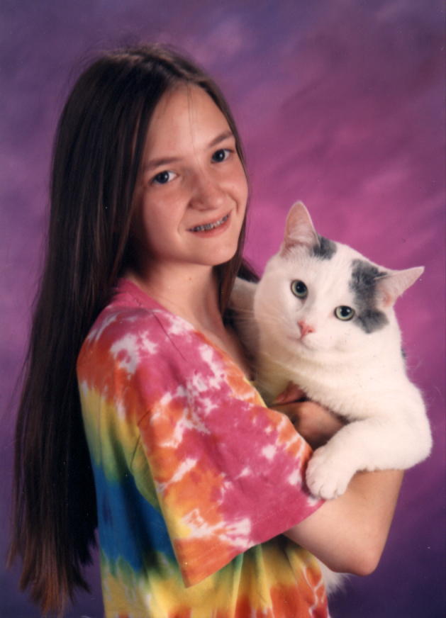 This is a photo of me and my favorite feline taken as a seniour picture, unfortunitly school would not allow the picture in the year book.&nbsp; Beasty passed away in November of 1999 and I miss him very much.&nbsp; There will never be another cat like him, he was very affectionate and loved to cuddled and held.&nbsp; At 20 pounds he was a big baby!