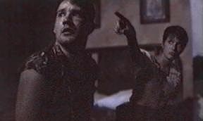 Dawn (Jillian Hodges) shows Dean (Brad Goodman) something scary - or perhaps gives him directions to the restroom