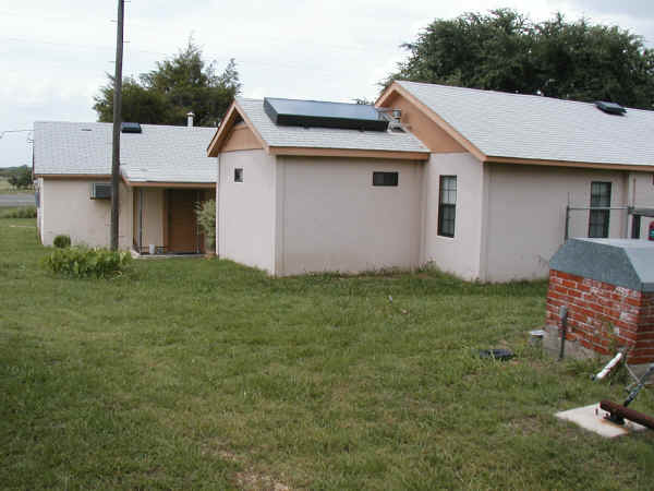 Back corner of house and office building