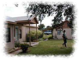 View of front yard and area between front of house and office building