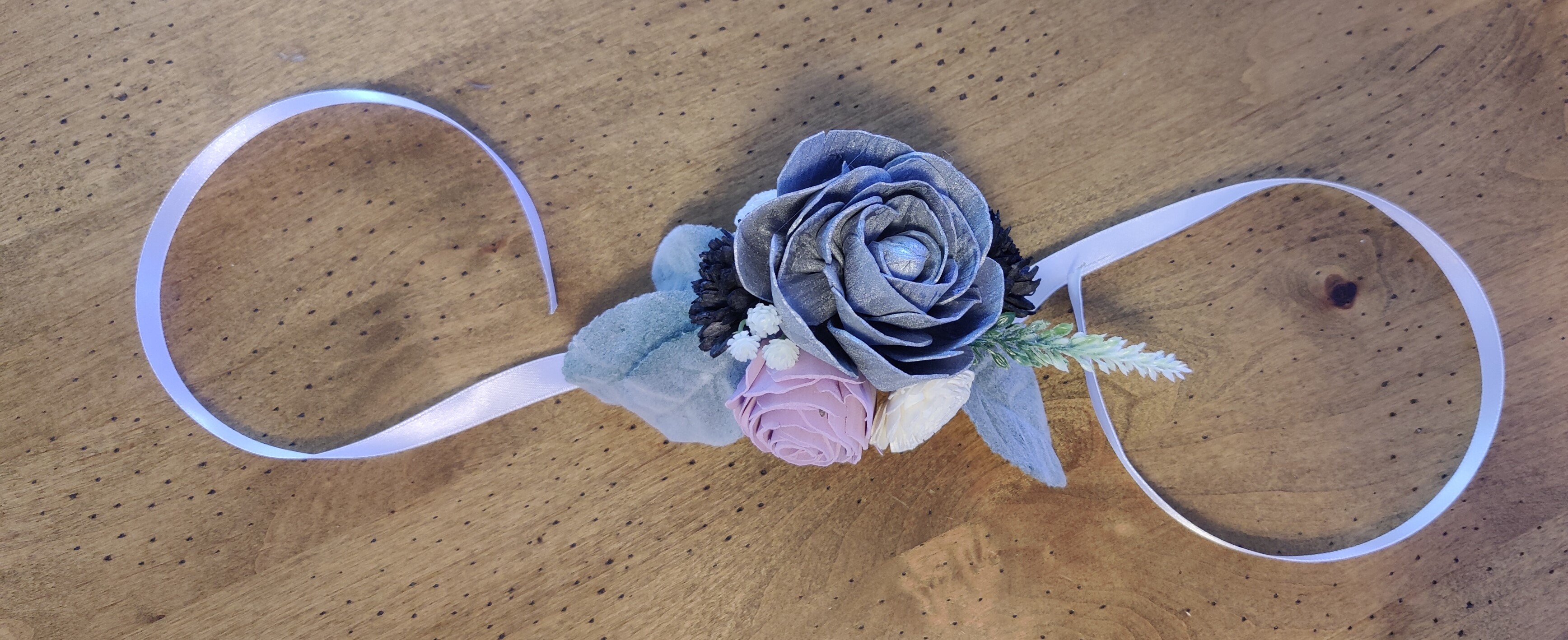 silver, lilac, and black corsage