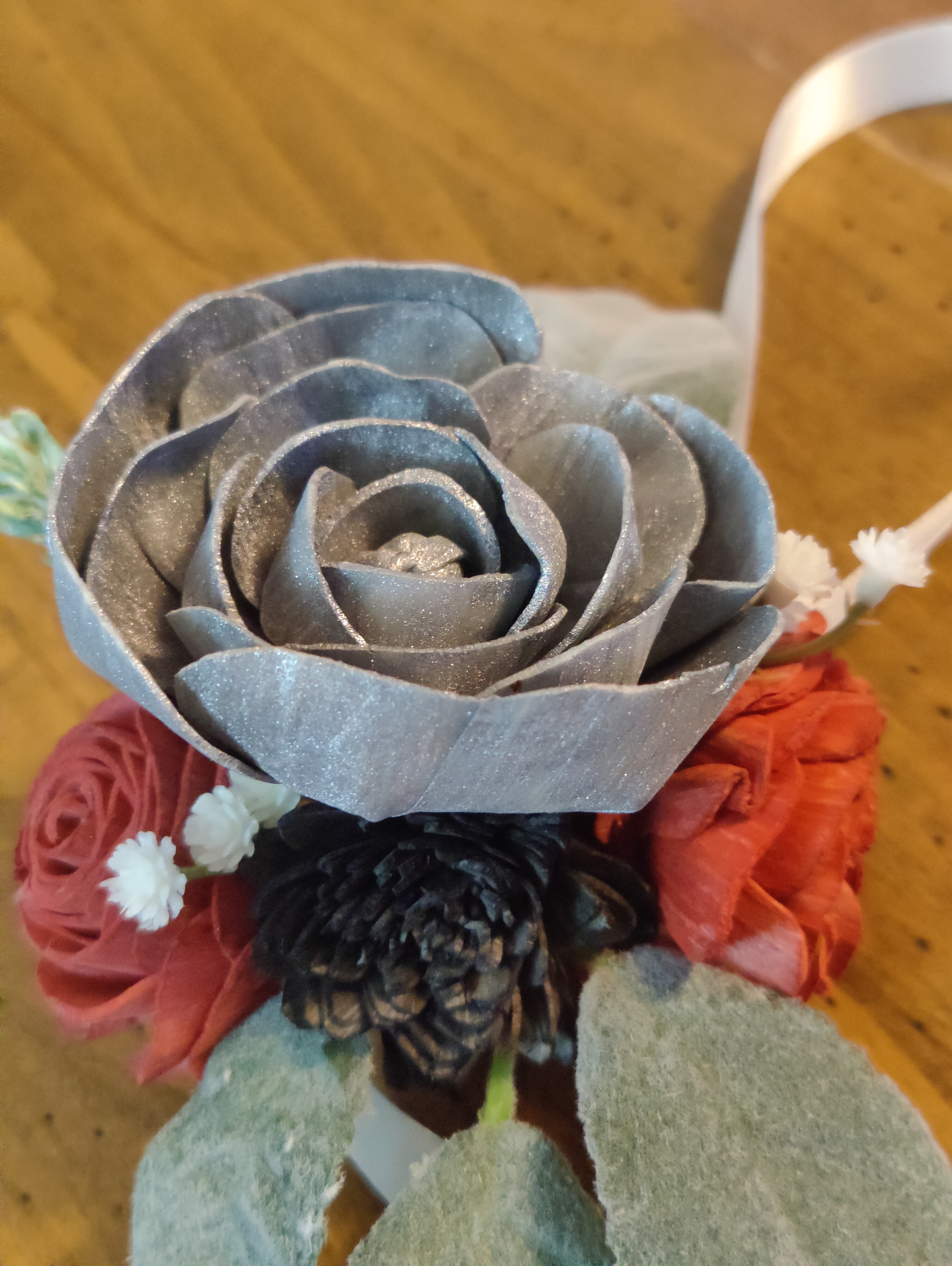 silver, red, and black corsage