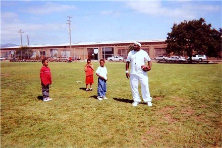 Coach encourages the camp attendees to participate.&nbsp; He yells "Get your hands outta your pockets!"&nbsp; Boy does he have a real hold on that football!