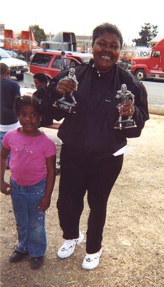Mom proudly showing her Award winner's 2 trophies.&nbsp; Day 3 of Camp, July 31st 2004