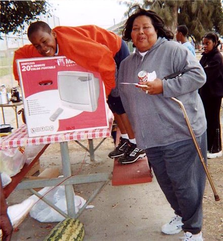 Our lottery Grand Prize Winner!&nbsp; That's her son all over the TV! Day 3 of Camp - July 31st 2004