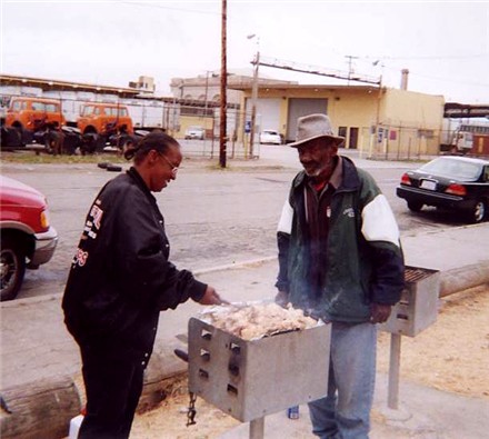 The man on the right is Emmit.&nbsp; We picked him up at the shelter he lives in and brought him out cos' he wanted to help out.&nbsp; He quickly took over instructions for proper down-home BBQing!&nbsp; July 31st 2004