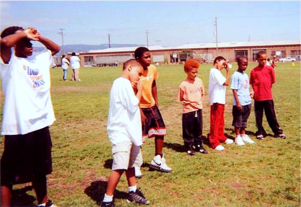 The young brothers demonstrating their listening skills as the coaches give instructions. 