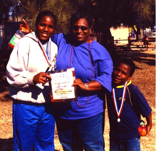 Pictured here with her loving & supportive Mom & her younger brother is our champion!&nbsp; Narreesha Sapp.