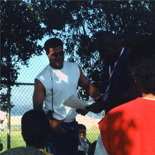 Coach Parker awarding one of the fellow coaches & instructors at this years Show-Time Free Football Camp.