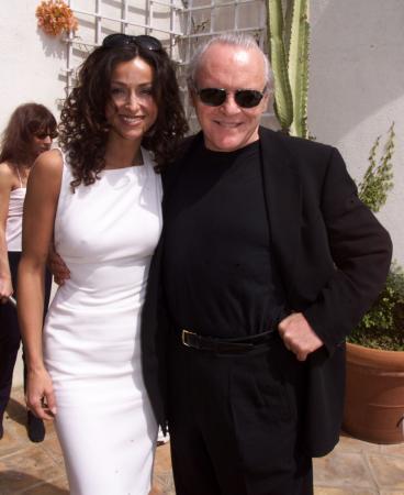 BEVERLY HILLS, CALIFORNIA - Italian actress Sofia Milos poses with actor Anthony Hopkins prior to a luncheon honoring Italian Academy Award nominees at Dino DeLaurentiis' mansion in Beverly Hills March 24. Hopkins is starring in the upcoming film 'Hannibal' produced by DeLaurentiis. Milos was a guest at the luncheon. The Academy Awards will be presented March 26 in Los Angeles. fsp/Photo by Rose Prouser (Reuters)