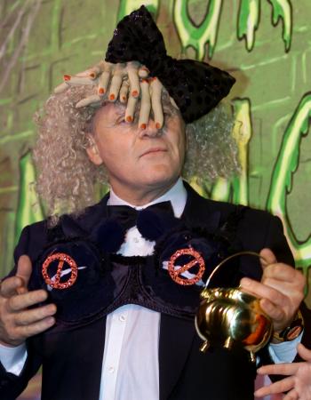 Sir Anthony Hopkins holds the traditional 'Hasty Pudding Pot,' wearing a hat of fake human fingers and a bra festooned with black lambs' heads while being honored February 15, 2001 as Harvard University's 'Hasty Pudding 2001 Man of the Year.'  Photo by Jim Bourg (Reuters)