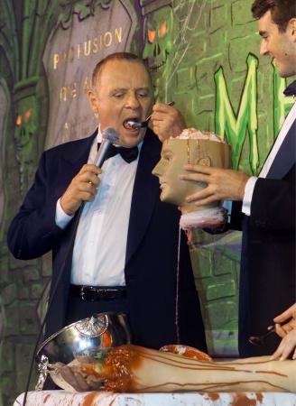 British actor and 'Hannibal' star Sir Anthony Hopkins accepts a challenge from Harvard student Ben Forkner and eats fake brains from a plastic head as Hopkins was honored as Harvard University's 'Hasty Pudding 2001 Man of the Year' February 15, 2001.  Photo by Jim Bourg (Reuters)