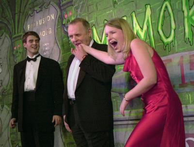 Anthony Hopkins takes a little nibble of Suzanne Pomey's hand as Ben Forkner watches at the Hasty Pudding Theater in Cambridge, Mass., Thursday, Feb. 15, 2001. Hopkins received the man of the year award from members of the Hasty Pudding Theatricals.  Photo by Lawrence Jackson (AP)