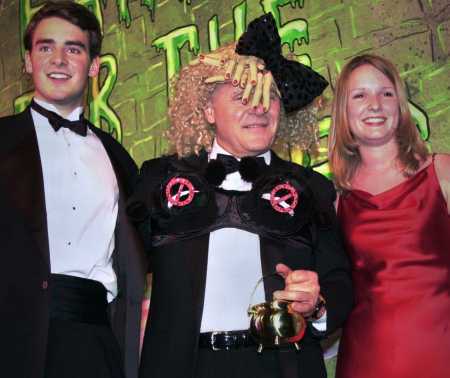 Sir Anthony Hopkins poses with Ben Forkner and Suzanne Pomey at the Hasty Pudding Theater in Cambridge, Mass., Thursday, Feb. 15, 2001. Hopkins is the 35th man to receive the award. Both Pomey and Forkner are Harvard students and producers of the Hasty Pudding Theatricals. (AP Photo/Lawrence Jackson)