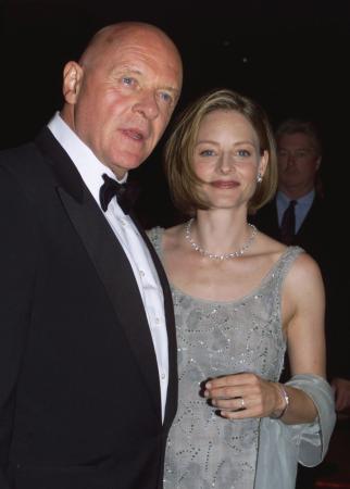 BEVERLY HILLS, CALIFORNIA - Actress Jodie Foster poses with actor Sir Anthony Hopkins as they arrive for the American Cinematheque Moving Picture Ball October 9 in Beverly Hills. Foster was honored at the Ball for her significant contribution to the art of film and video.  Photo by Rose Prouser (Reuters)