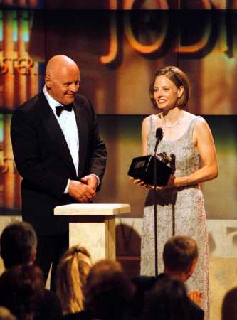 Anthony Hopkins presents Oscar-winning actress Jodie Foster with the American Cinematheque award Saturday night, Oct. 9, 1999, during a taped salute to her in Beverly Hills, Calif. The show will air Sunday, Oct. 17, 1999, on Turner Network Television. (AP Photo/TNT, Craig T. Matthew)
