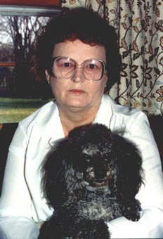Mama holding Peppy in the kitchen of our home on Dana Ave. in Waukegan, Illinois
