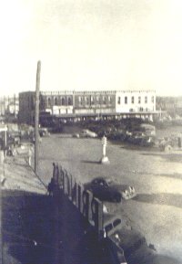 made 1946(?) picture of old Weatherford Square from the Palace Projection Booth looking East with Hardware store, Duke & Ayres, the 1st National Bank