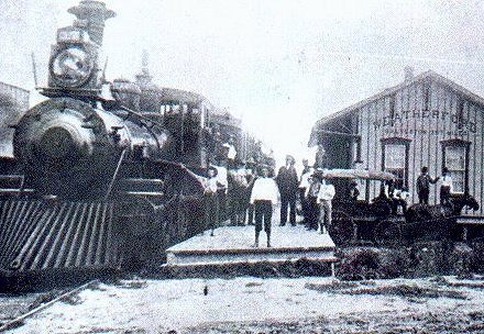 Sante Fe Depot and the first Sante Fe Passenger train to arrive in Weatherford November 1, 1887.