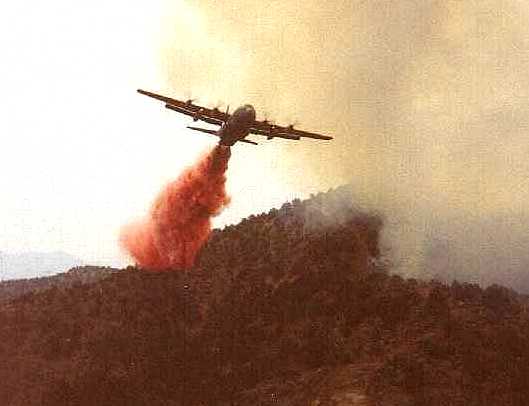 A National Guard C-130 dropping slurry.