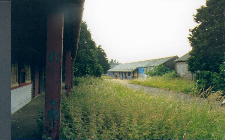 (c.1996) looking up the road towards the main gate, the building on the left is the book store, the one to the right in the middle picture is Brians billet which was lastly used to store large metal items, now believed demolished. (picture by: Brian Kitching)