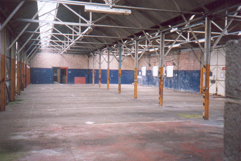 (c.1996) An internal view of one of the sheds, showing lower wall blue paint, rooms of at the end of the building, and the structure of the building