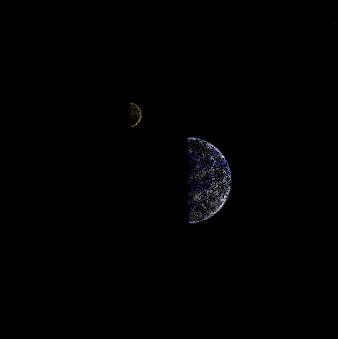 The Earth and Moon shadowed by darkness.