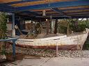 an old boat behind the hotel