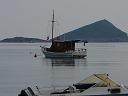 a boat in front of the island looking out from the port