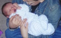 Aidyn being held by Lowell.