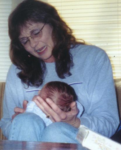 Debbie holding Aidyn.